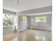 Large living room featuring light grey walls and wood floors at 836 Kensington St, Lakeland, FL 33803