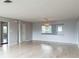 Spacious living room featuring hardwood floors and a large window at 836 Kensington St, Lakeland, FL 33803