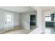 Bright living room with light wood floors, neutral walls, and a view into the kitchen at 836 Kensington St, Lakeland, FL 33803