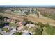 Aerial view showcasing houses near a golf course at 3017 Jon Jon Ct, Orlando, FL 32822