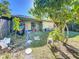 Backyard with lush landscaping and access to patio at 3017 Jon Jon Ct, Orlando, FL 32822