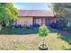 Large backyard with green grass and mature trees at 3017 Jon Jon Ct, Orlando, FL 32822