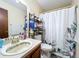 Clean bathroom with shower/tub combo, and a vanity with storage at 3017 Jon Jon Ct, Orlando, FL 32822
