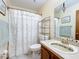 Updated bathroom with a shower/tub, toilet and vanity at 3017 Jon Jon Ct, Orlando, FL 32822