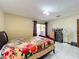 Bedroom with a queen bed, dresser and access to patio at 3017 Jon Jon Ct, Orlando, FL 32822