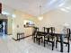 Bright dining room features a large table with seating for six at 3017 Jon Jon Ct, Orlando, FL 32822