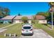 Three attached homes viewed from the driveway at 3017 Jon Jon Ct, Orlando, FL 32822