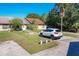 Inviting exterior of a charming house with a well-maintained lawn at 3017 Jon Jon Ct, Orlando, FL 32822
