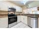 Modern kitchen featuring stainless steel appliances and granite countertops at 3017 Jon Jon Ct, Orlando, FL 32822