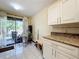 Bright kitchen with granite countertops and stainless steel appliances at 3017 Jon Jon Ct, Orlando, FL 32822