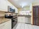 Updated kitchen with stainless steel appliances and granite countertops at 3017 Jon Jon Ct, Orlando, FL 32822