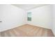 Small bedroom features neutral carpet, window with blinds, and fresh paint at 13490 Leaping Water Way, Astatula, FL 34705