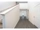 Bright entryway featuring gray wood-look floors leading to the living room at 13490 Leaping Water Way, Astatula, FL 34705
