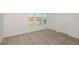 Bedroom featuring plush carpeting and a window providing lots of natural light and a double door closet at 4432 Sw 84Th Street Rd, Ocala, FL 34476