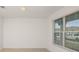 Bright bedroom with neutral walls, large window and tile flooring at 4432 Sw 84Th Street Rd, Ocala, FL 34476