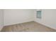 Bright bedroom featuring plush carpeting and a window for natural light at 4432 Sw 84Th Street Rd, Ocala, FL 34476