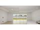 Bright and airy living area that connects to the backyard through sliding glass doors at 4432 Sw 84Th Street Rd, Ocala, FL 34476