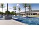 Enjoy the community pool area with tropical palm trees and shaded lounge spaces for relaxation and leisure at 4432 Sw 84Th Street Rd, Ocala, FL 34476