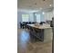 Modern kitchen with a granite island and bar stool seating at 1360 Se 63Rd Court Rd, Ocala, FL 34472