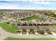 A captivating aerial view of a perfectly planned community with lush greenery and well-spaced homes at 3825 Quaint Ln # C, Clermont, FL 34711