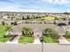 An aerial shot showcases the community layout, lush landscaping, and well-maintained homes at 3825 Quaint Ln # C, Clermont, FL 34711