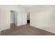 Bedroom with carpeting with view to bathroom and closet space at 3825 Quaint Ln # C, Clermont, FL 34711