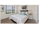 Stylishly staged bedroom featuring a comfortable bed, side tables, and tasteful decor at 3825 Quaint Ln # C, Clermont, FL 34711