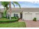 Townhome showing off the exterior and a small front yard at 3825 Quaint Ln # C, Clermont, FL 34711