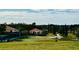 Scenic greenspace with putting green, gazebo, and manicured landscaping for outdoor enjoyment at 3825 Quaint Ln # C, Clermont, FL 34711