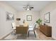 Bright and stylish home office with modern furniture, neutral colors, and ample natural light at 3825 Quaint Ln # C, Clermont, FL 34711