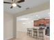Kitchen featuring stainless steel appliances, tile floors, breakfast bar and pendant lighting at 3825 Quaint Ln # C, Clermont, FL 34711