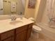 Clean bathroom with light wood vanity, single sink, and bathtub at 2196 Kershaw Rd, The Villages, FL 32162