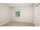 A simple bedroom with a window and closet at 5414 Sw 85Th Avenue Rd, Ocala, FL 34481