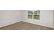 Cozy bedroom with neutral carpeting and a bright window at 5414 Sw 85Th Avenue Rd, Ocala, FL 34481