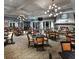 Elegant dining area featuring stylish lighting, fireplace, and ample seating for a refined dining experience at 5414 Sw 85Th Avenue Rd, Ocala, FL 34481