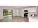 Bright, open kitchen with stainless steel appliances and access to the backyard patio at 5414 Sw 85Th Avenue Rd, Ocala, FL 34481