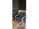 Furnished balcony with a comfortable chair and nautical decor at 1640 Juno Trl # 202E, Astor, FL 32102