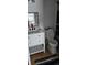 Clean bathroom with a white vanity and shower/tub combo at 1640 Juno Trl # 202E, Astor, FL 32102