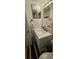Modern bathroom with a white vanity and updated fixtures at 1640 Juno Trl # 202E, Astor, FL 32102
