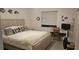 Cozy bedroom with a queen-size bed and built-in workspace at 1640 Juno Trl # 202E, Astor, FL 32102