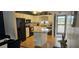 Open concept kitchen with granite island and breakfast bar at 1640 Juno Trl # 202E, Astor, FL 32102