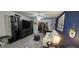 Bright living room featuring a fireplace and comfortable seating at 1640 Juno Trl # 202E, Astor, FL 32102