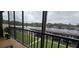 Relaxing screened balcony overlooking the water and boat docks at 1640 Juno Trl # 202E, Astor, FL 32102