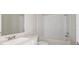 Clean bathroom with white subway tiles and a bathtub at 8323 Sw 52Nd Lane Rd, Ocala, FL 34481