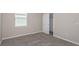 Bright bedroom with carpet flooring and a walk-in closet at 8323 Sw 52Nd Lane Rd, Ocala, FL 34481
