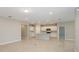 Open concept kitchen with island and view into living room at 8323 Sw 52Nd Lane Rd, Ocala, FL 34481