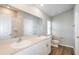 Modern bathroom featuring double sinks, spacious countertop, and a tub with tiled shower at 9569 Sw 62Nd Ct, Ocala, FL 34476