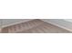 Close-up of the bedroom's carpet, baseboard and corner featuring a window with blinds at 9569 Sw 62Nd Ct, Ocala, FL 34476