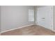 Carpeted bedroom with double door closet, window and neutral colored walls and baseboards at 9569 Sw 62Nd Ct, Ocala, FL 34476