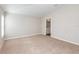 Carpeted bedroom offers a neutral color scheme, one window and an attached bathroom at 9569 Sw 62Nd Ct, Ocala, FL 34476